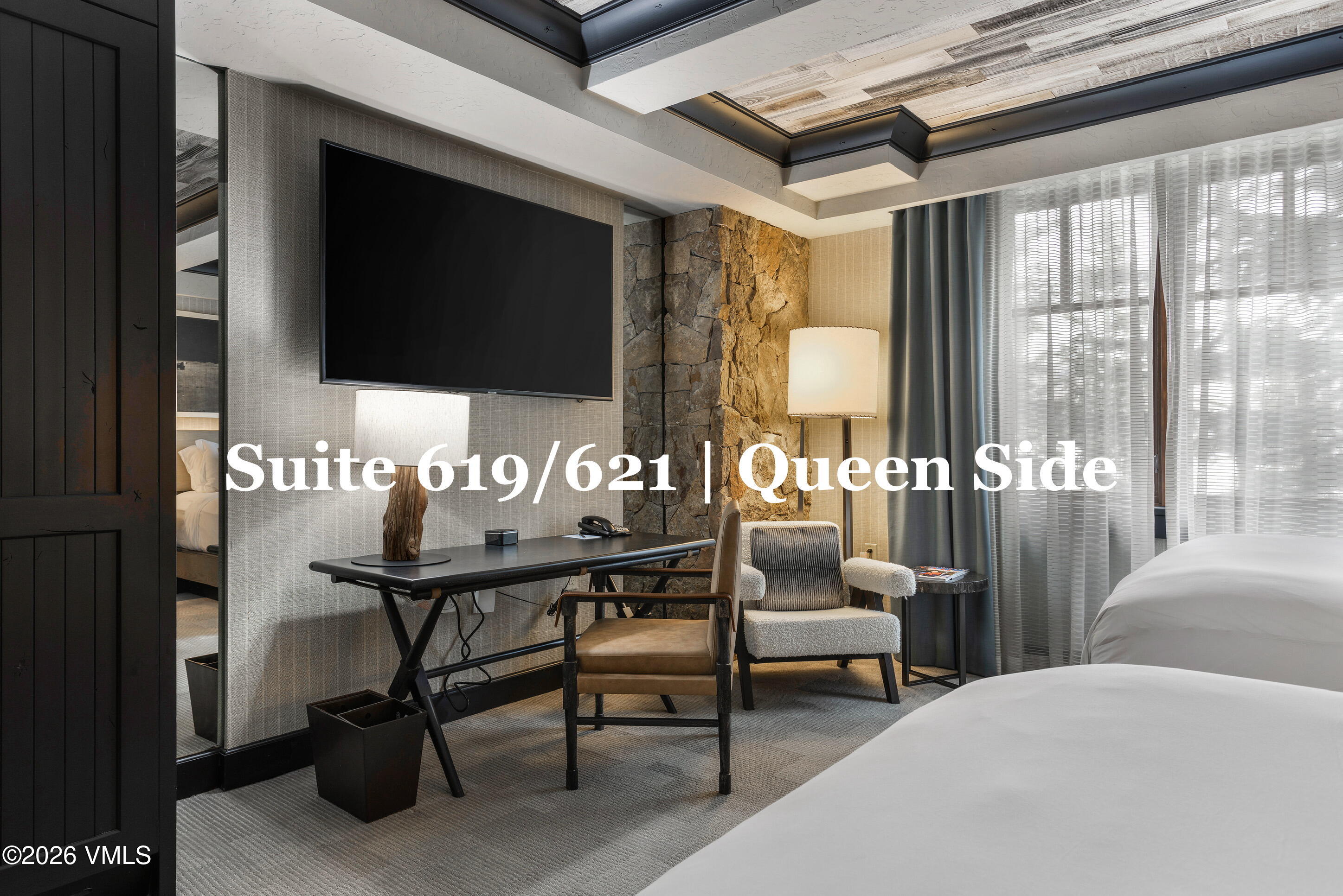 130 Daybreak Ridge Road, Unit HS619 Avon, CO 81620 - Photo 50 of 75 a living room with furniture and a flat screen tv