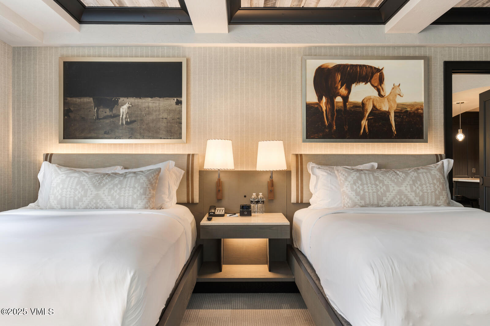 130 Daybreak Ridge Road, Unit HS619 Avon, CO 81620 - Photo 53 of 75 a bedroom with a bed and a painting on the wall