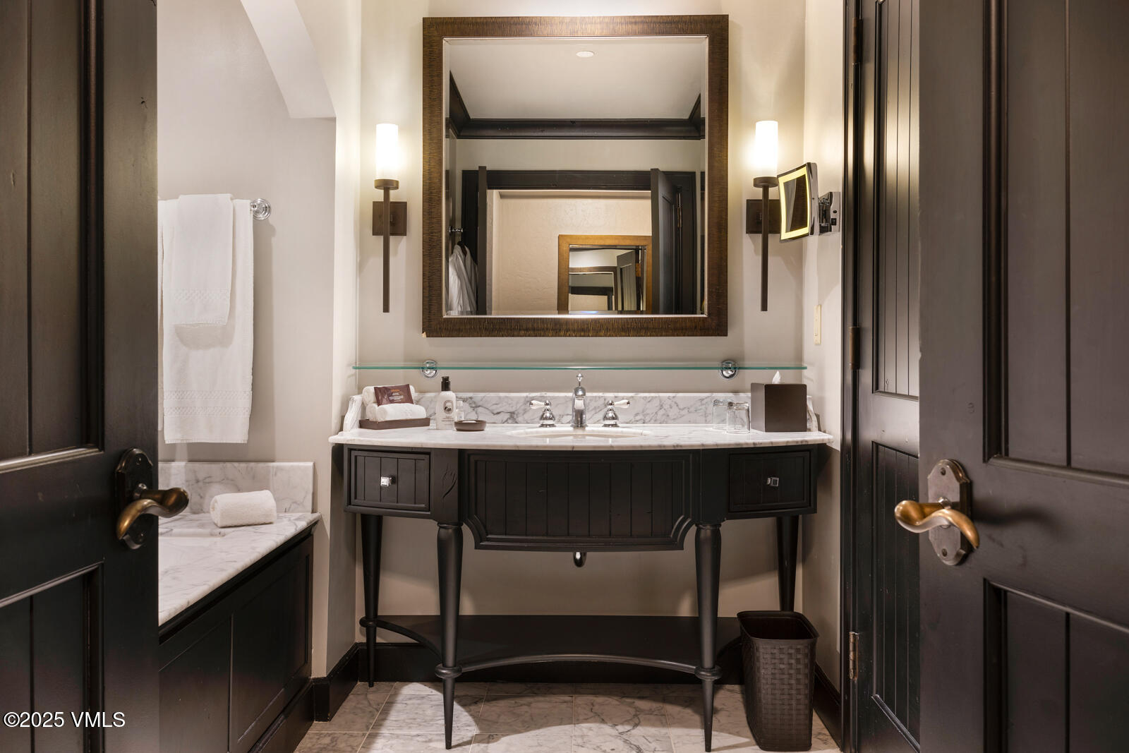 130 Daybreak Ridge Road, Unit HS619 Avon, CO 81620 - Photo 59 of 75 a bathroom with a sink and a mirror