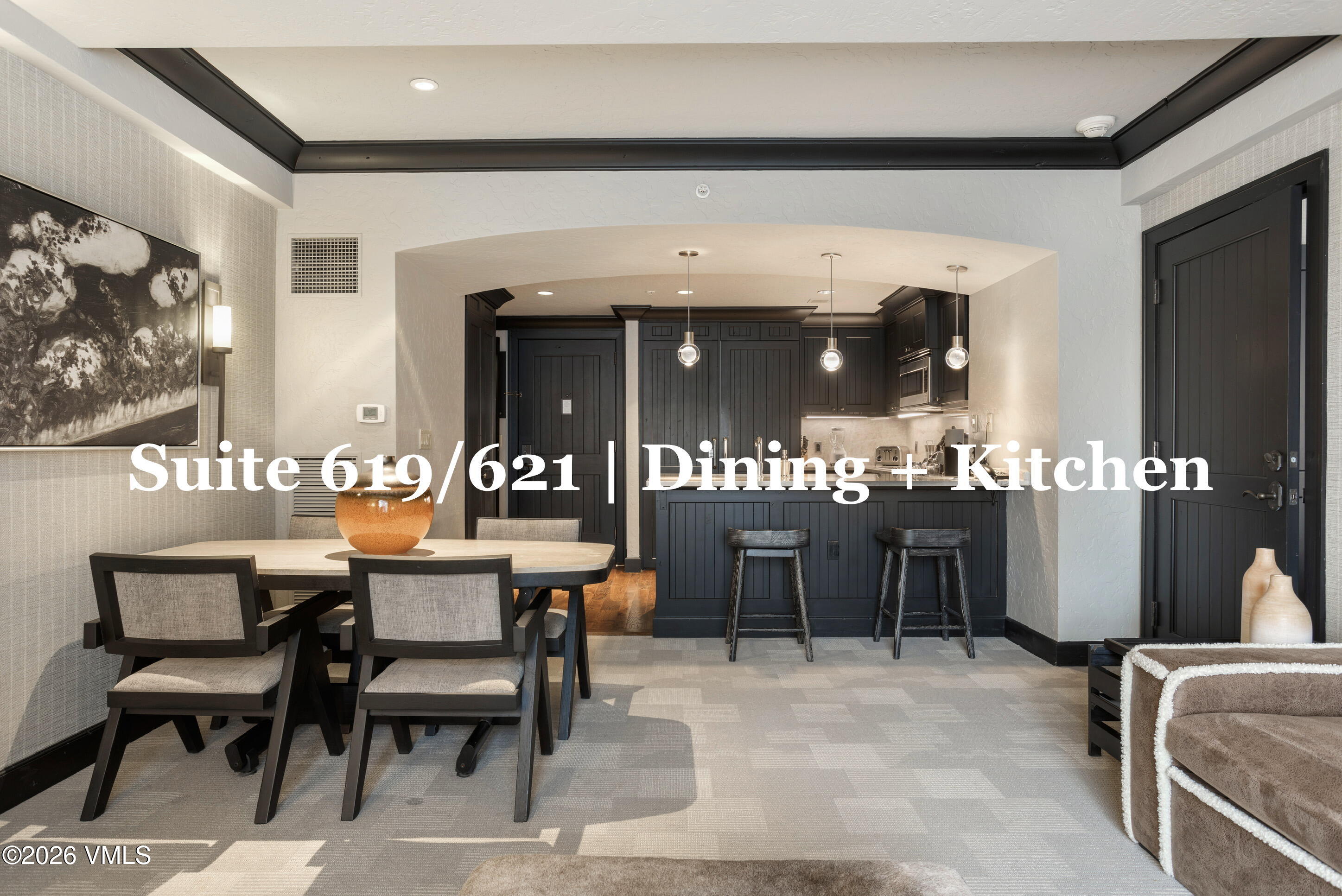 130 Daybreak Ridge Road, Unit HS619 Avon, CO 81620 - Photo 8 of 75 a dining hall with stainless steel appliances kitchen island granite countertop a dining table chairs and a refrigerator