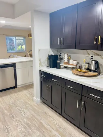a bathroom with a granite countertop toilet sink and mirror