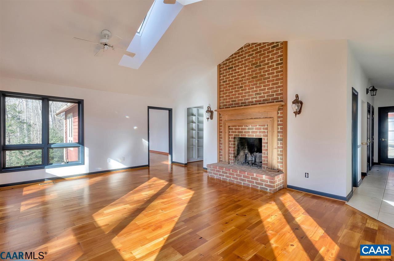 2138 Jacks Shop Road Rochelle, VA 22738 - Photo 8 of 31 a view of a livingroom with wooden floor and a fireplace