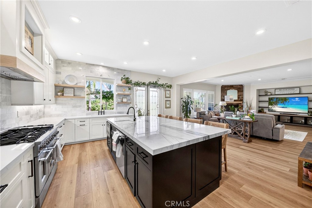 16375 Ory Circle Riverside, CA 92503 - Photo 15 of 51 a kitchen with counter top space a sink appliances and cabinets