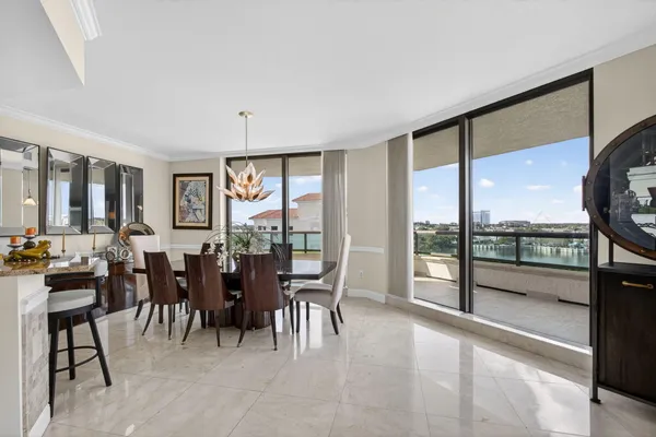 a living room with furniture large window and flat screen tv