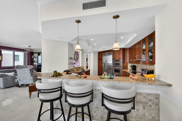 a bathroom with a tub a sink shower and mirror
