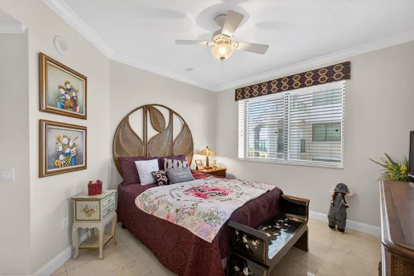 a living room with furniture a pool table and a large window