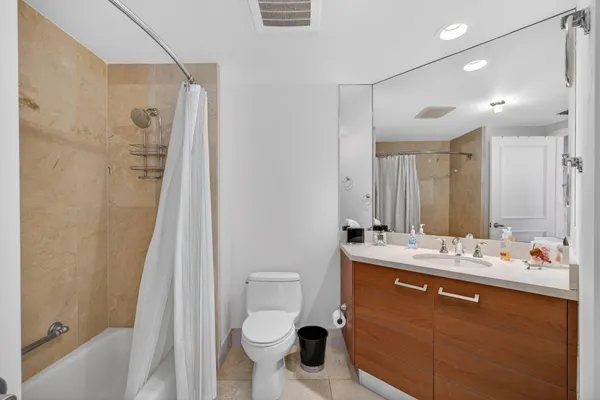 a view of a livingroom with furniture and workspace