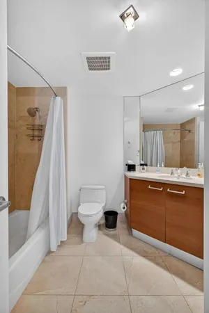 a kitchen with stainless steel appliances a refrigerator and a stove