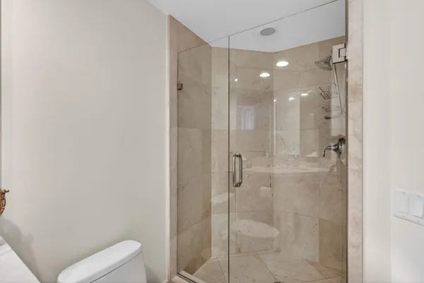 an aerial view of residential houses with outdoor space and street view