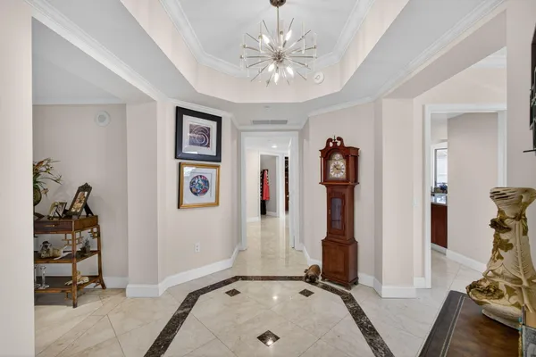 a living room with furniture a rug and a large window