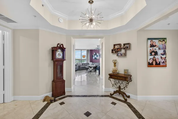a living room with furniture a rug and a flat screen tv