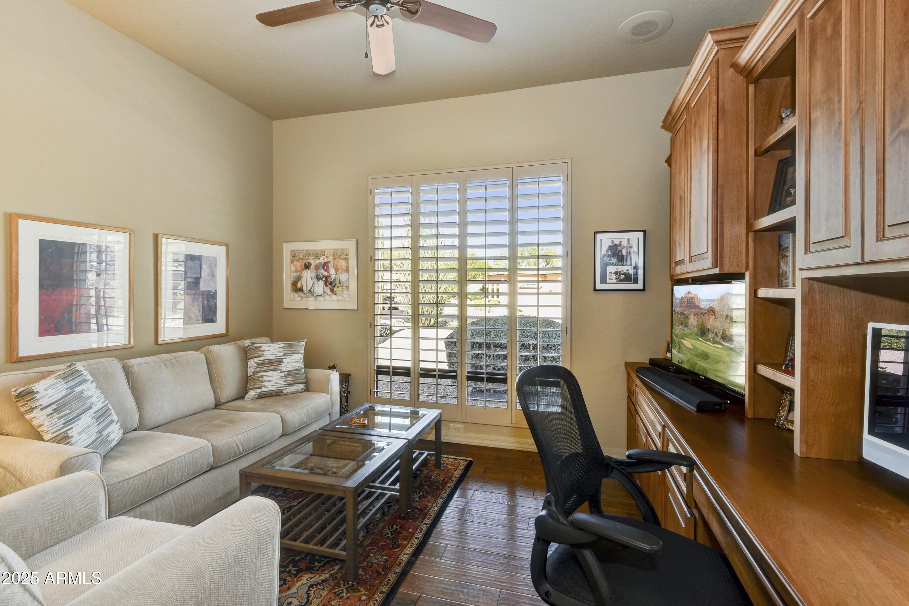 25004 North Vado Court Rio Verde, AZ 85263 - Photo 14 of 18 a living room with furniture and a flat screen tv