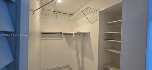 a view of an empty walk in closet