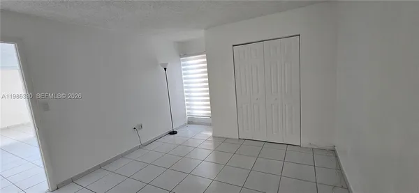 a view of an empty room with window