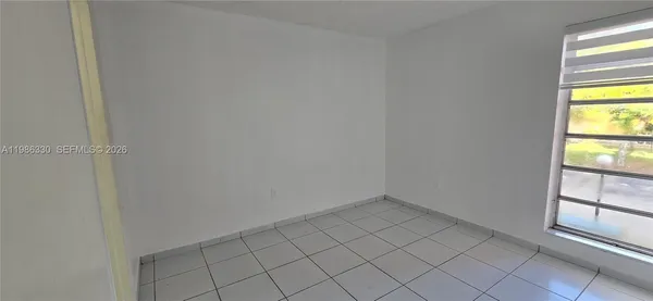 a view of an empty room and window