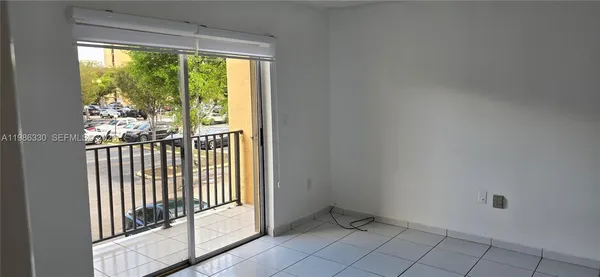 a view of a room that has a large window