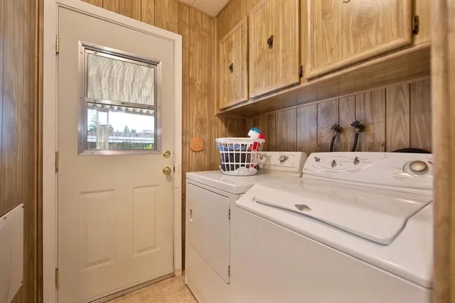 a kitchen with kitchen island sink stove and cabinets