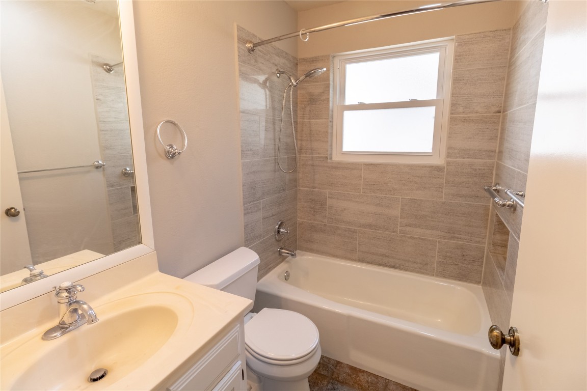 5839 Secrest Drive Austin, TX 78759 - Photo 13 of 34 Bathroom with shower / bathtub combination and vanity