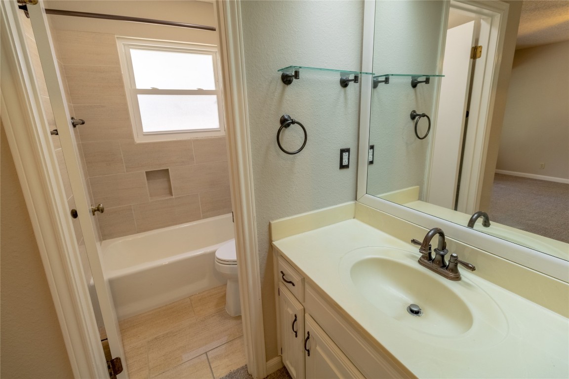 5839 Secrest Drive Austin, TX 78759 - Photo 18 of 34 Bathroom with vanity and shower / washtub combination