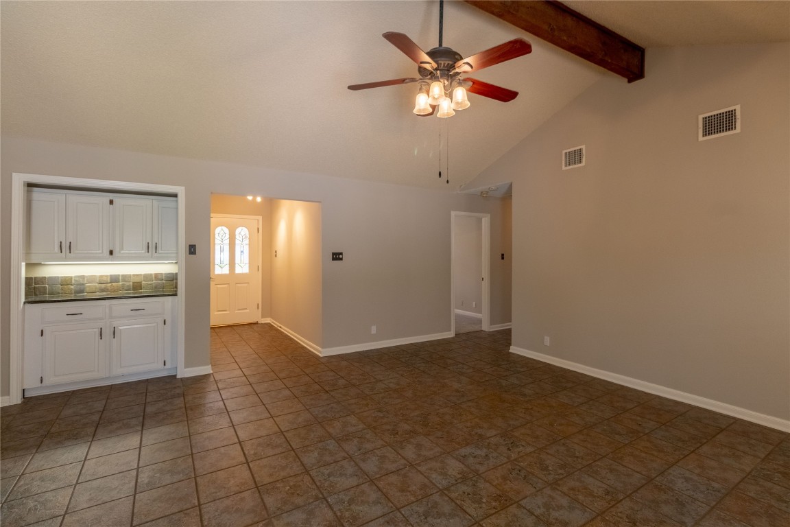 5839 Secrest Drive Austin, TX 78759 - Photo 32 of 34 Unfurnished living room with ceiling fan and baseboards