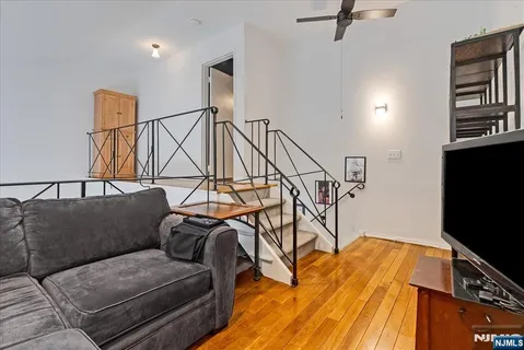 a living room with a couch and a flat screen tv