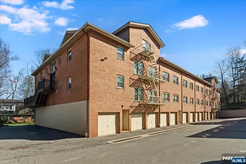 a sign that is on a brick building