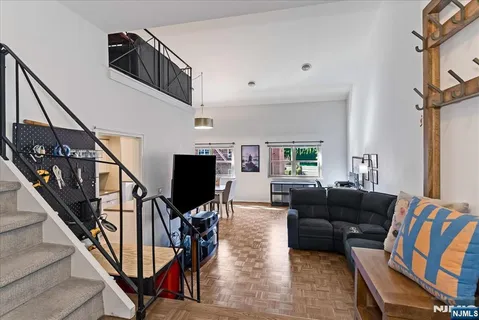 a living room with fireplace furniture and a flat screen tv