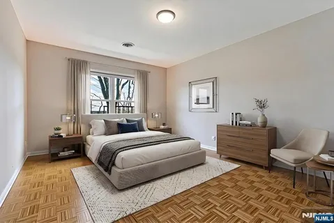 a bedroom with a bed and a couch