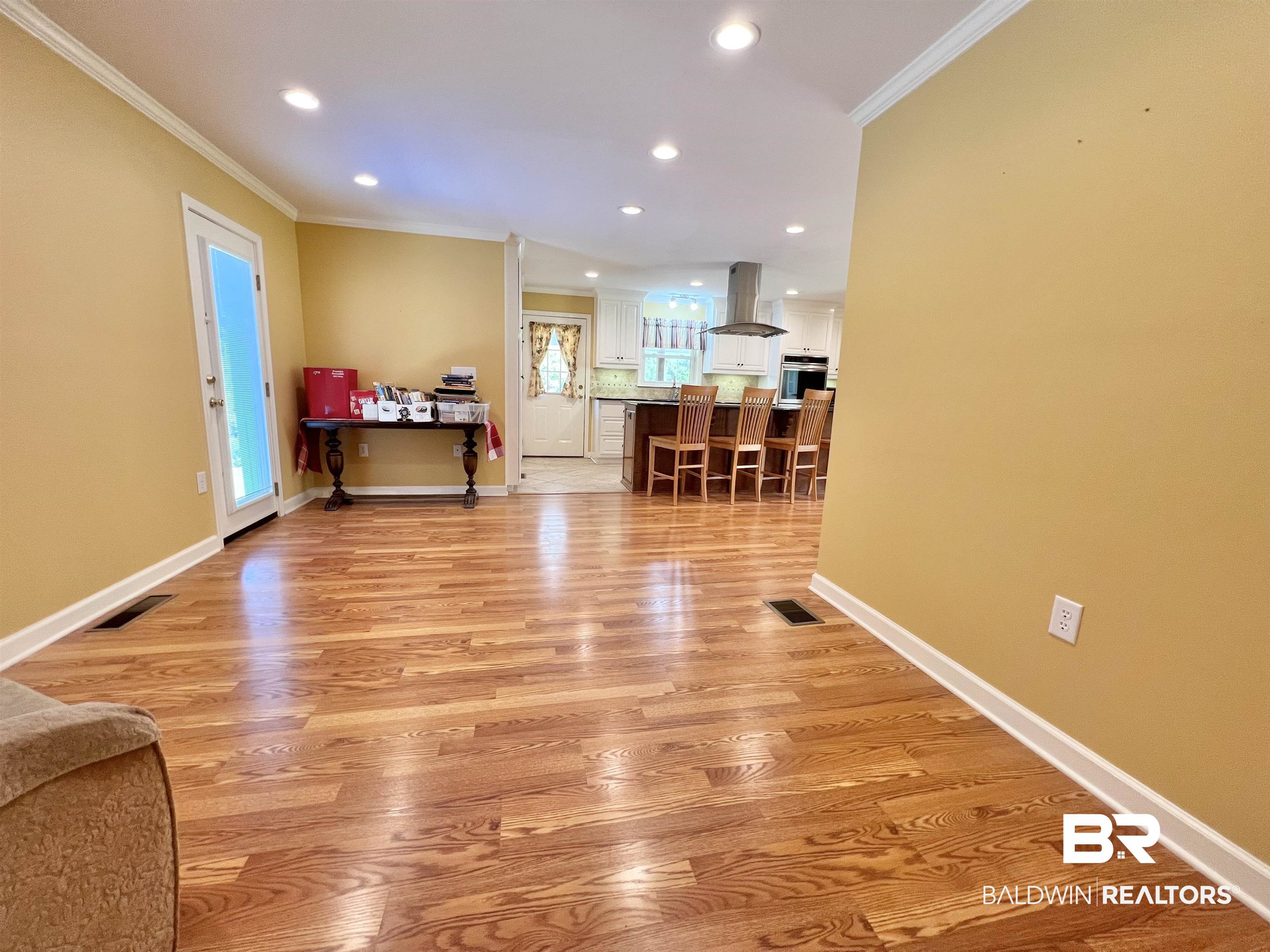 2691 Appleton Road Brewton, AL 36426 - Photo 6 of 60 Living area with light wood-style flooring, crown molding, and recessed lighting