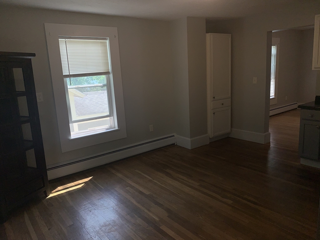 230 Prospect Street Athol, MA 01331 - Photo 11 of 19 an empty room with wooden floor and windows