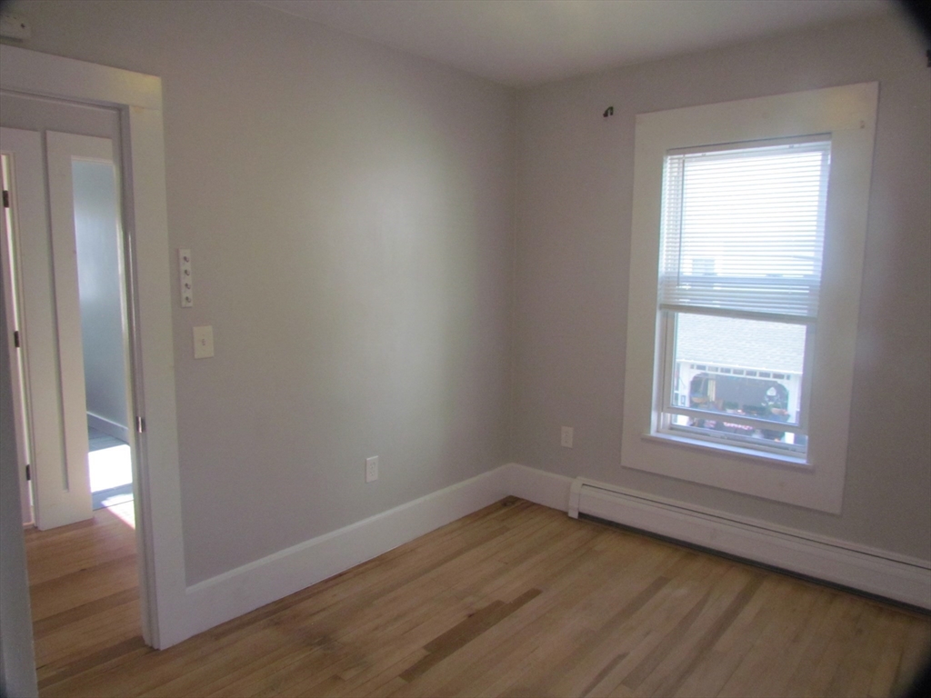230 Prospect Street Athol, MA 01331 - Photo 16 of 19 an empty room with wooden floor and windows