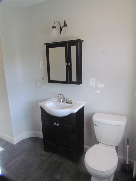 230 Prospect Street Athol, MA 01331 - Photo 18 of 19 a bathroom with a toilet sink and mirror