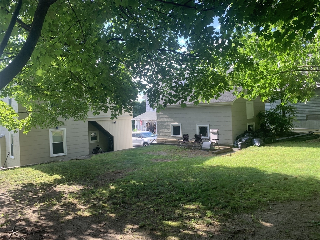 230 Prospect Street Athol, MA 01331 - Photo 4 of 19 a view of a house with a yard and sitting area