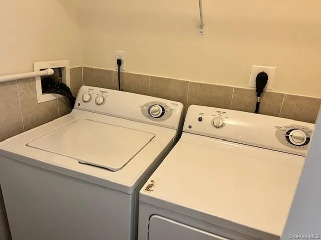 a utility room with dryer and washer