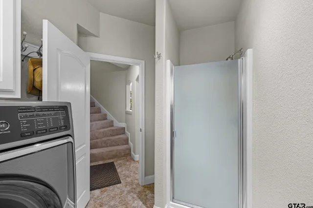 a view of a hallway with staircase