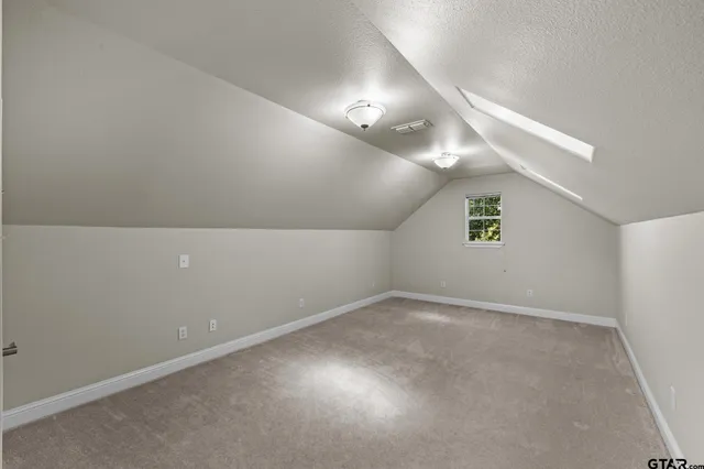 an empty room with a empty space and windows