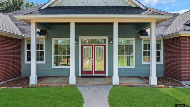 a view of front door of house with yard