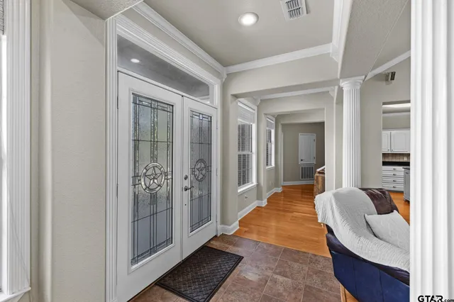 a balcony with furniture and a rug