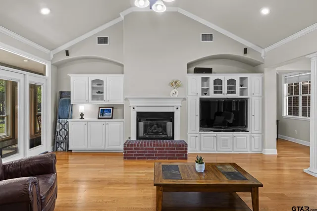 a living room with furniture and a fireplace