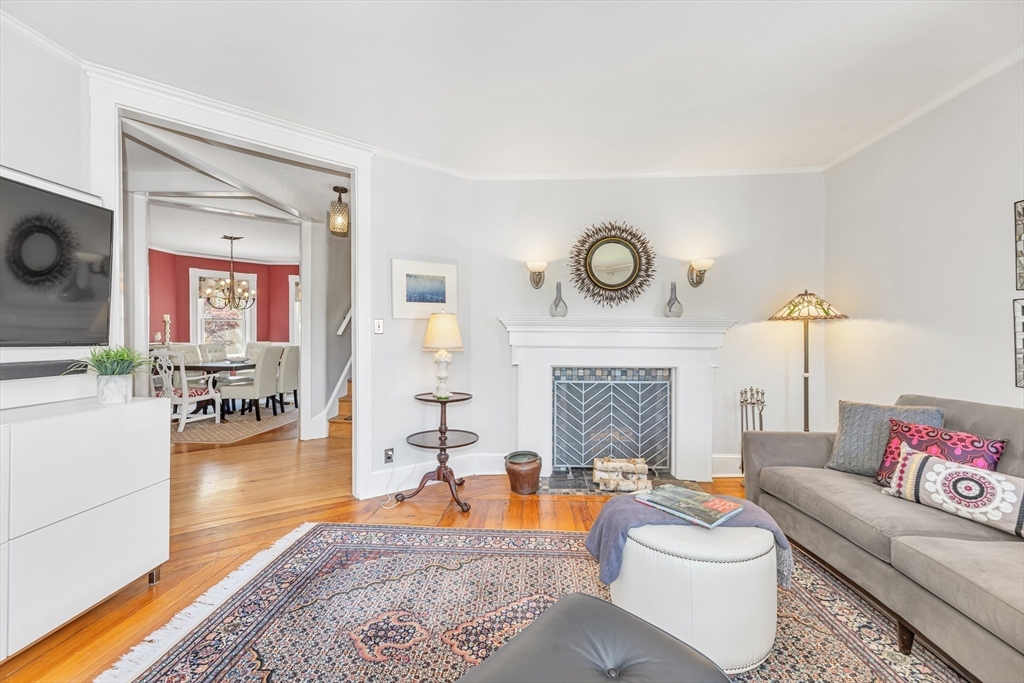 112 Perham Street Boston, MA 02132 - Photo 6 of 36 a living room with furniture a fireplace and wooden floor