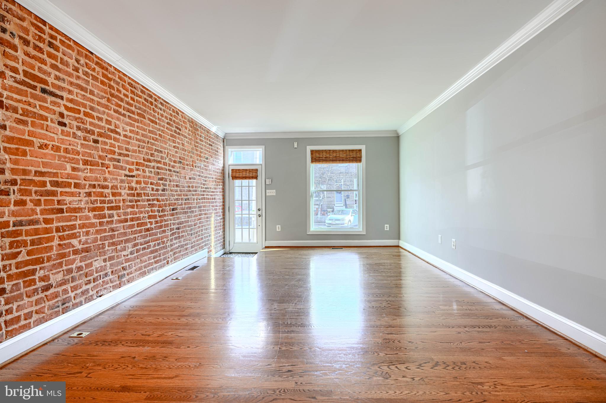 612 South Clinton Street Baltimore, MD 21224 - Photo 2 of 39 Exposed brick and hardwoods