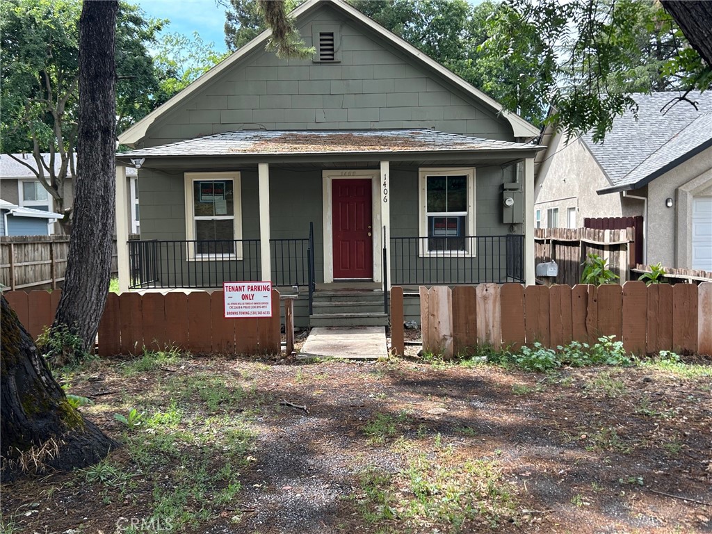 a front view of a house with a yard and a garage