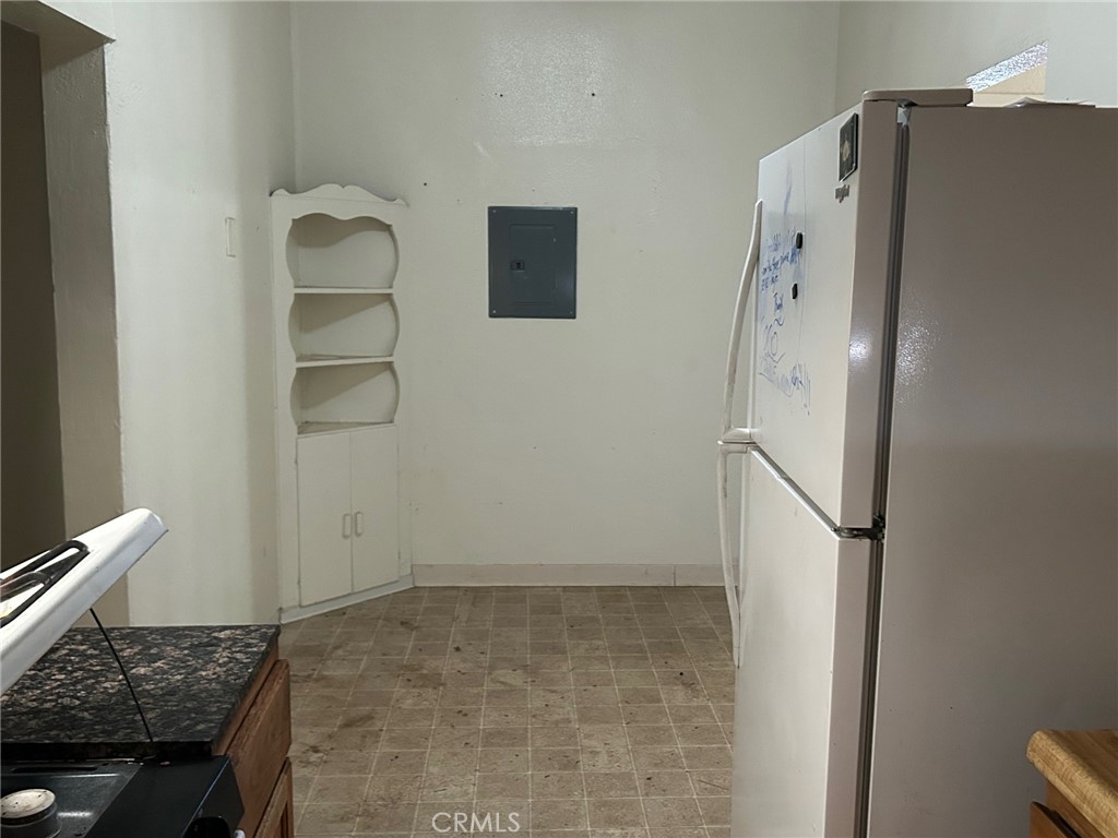 1406 West 7th Street Chico, CA 95928 - Photo 10 of 15 a bathroom with a granite countertop shower and a sink