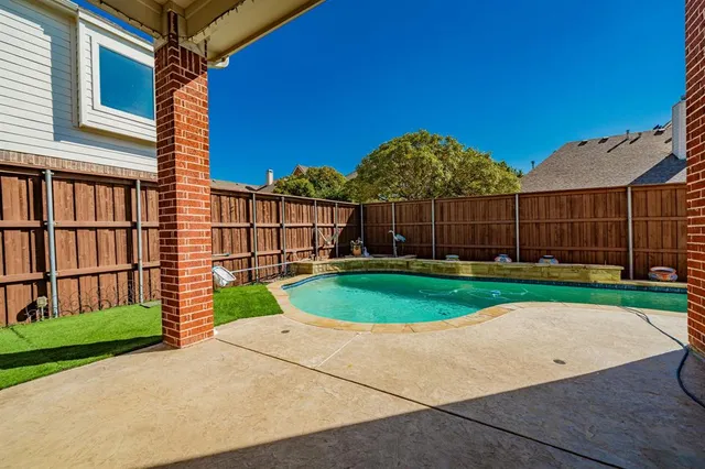 a view of a backyard with a tub