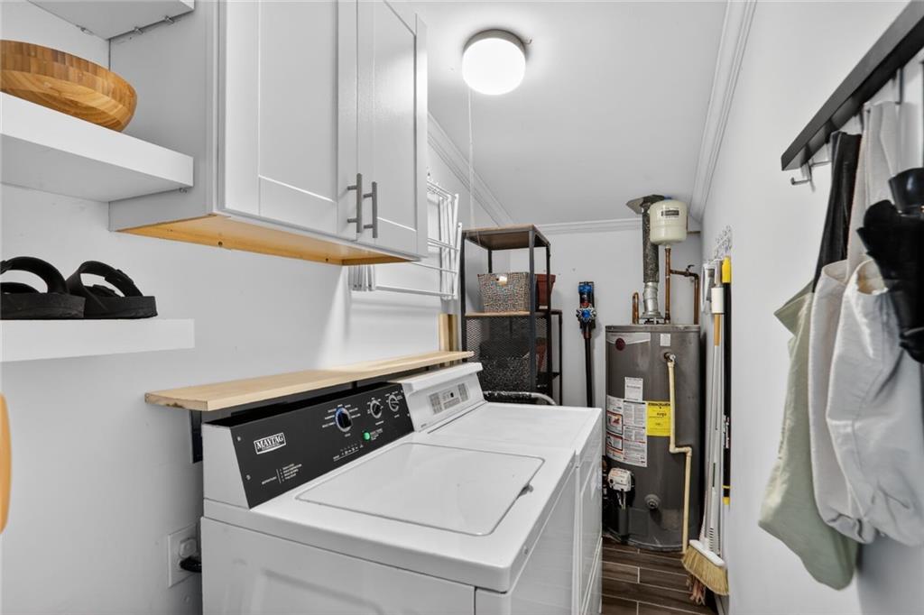 1267 Lyle Place Northwest Atlanta, GA 30318 - Photo 11 of 15 a kitchen that has a lot of cabinets