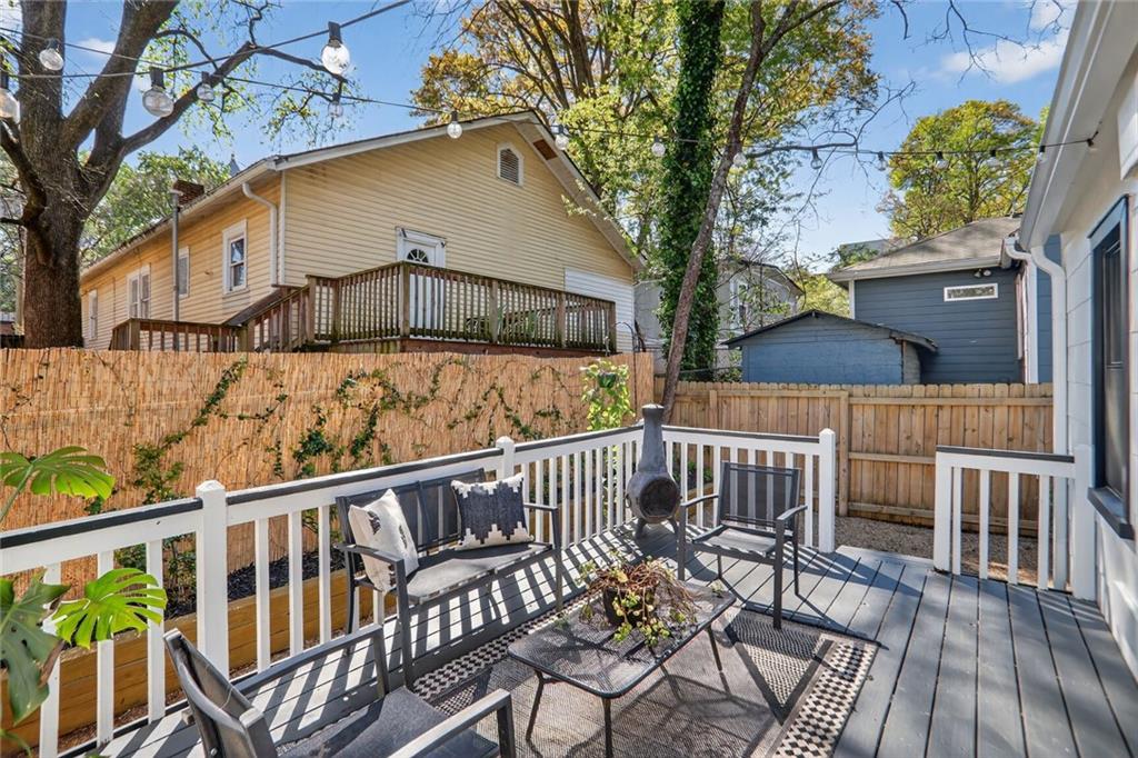 1267 Lyle Place Northwest Atlanta, GA 30318 - Photo 12 of 15 a view of a chairs on wooden deck
