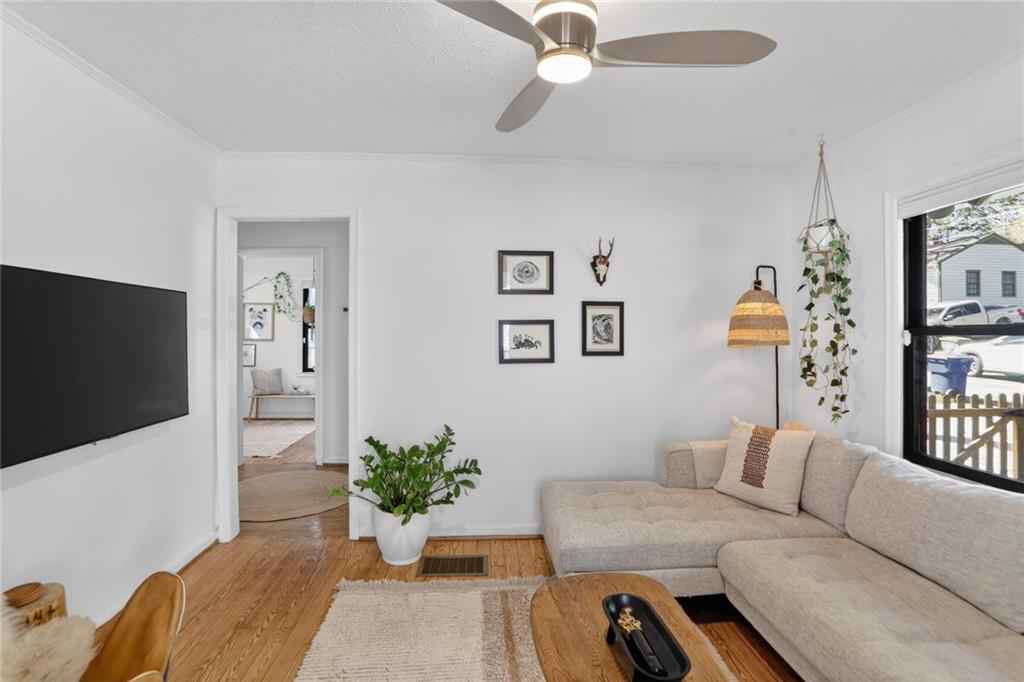 1267 Lyle Place Northwest Atlanta, GA 30318 - Photo 3 of 15 a living room with furniture and a flat screen tv