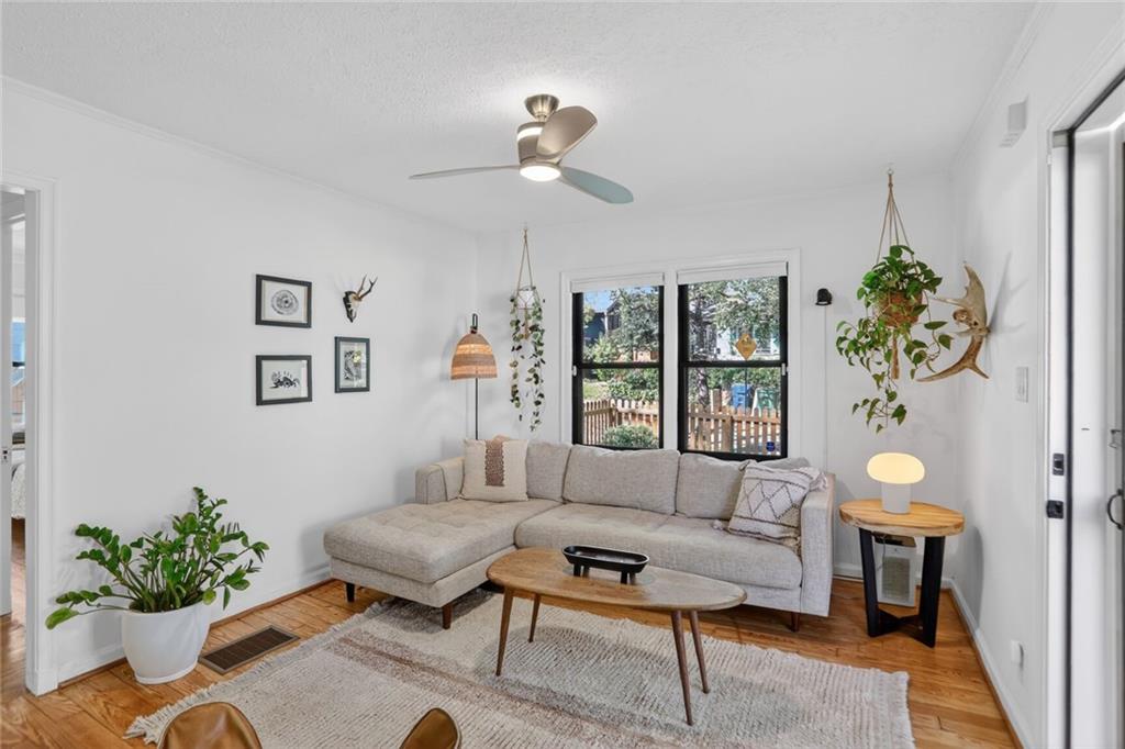 1267 Lyle Place Northwest Atlanta, GA 30318 - Photo 4 of 15 a living room with furniture and a potted plant