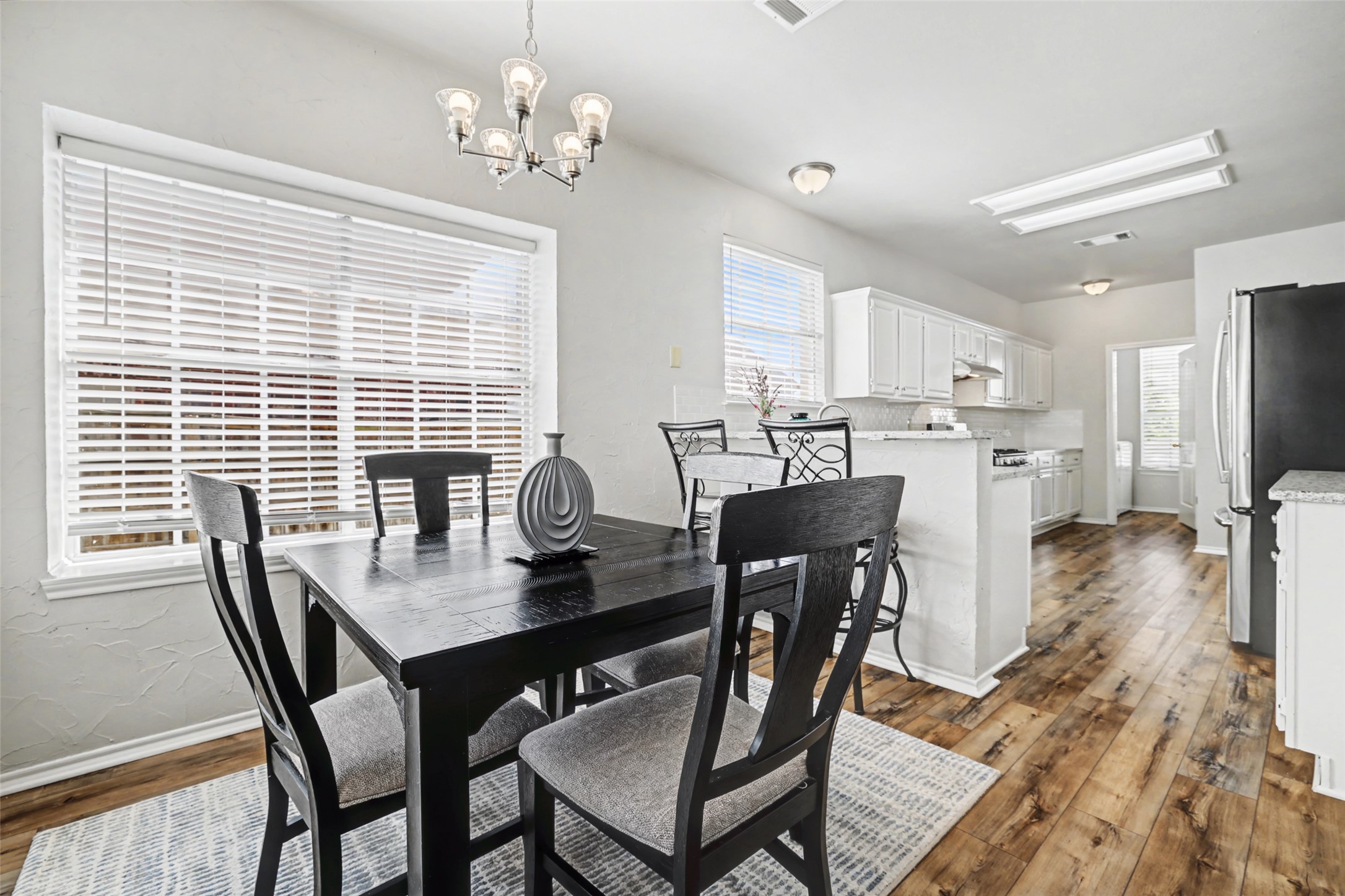 1109 Pebble Brook Road Cedar Park, TX 78613 - Photo 12 of 40 Dining room featuring hanging lights and dark wood-style flooring