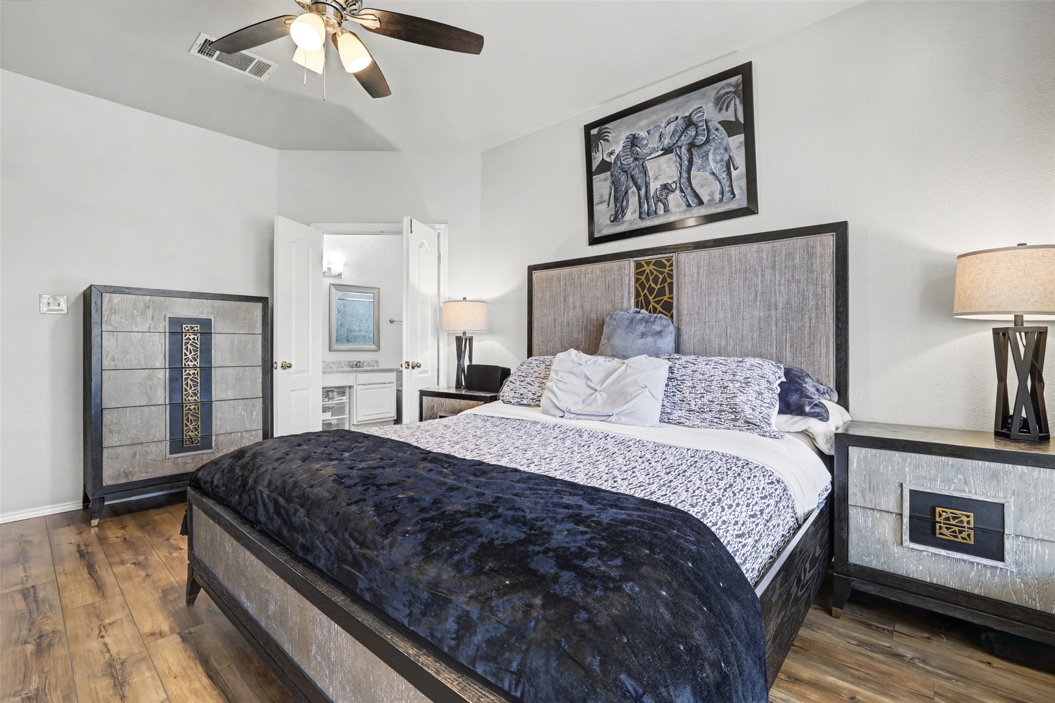 1109 Pebble Brook Road Cedar Park, TX 78613 - Photo 19 of 40 Bedroom with dark wood finished floors and a ceiling fan